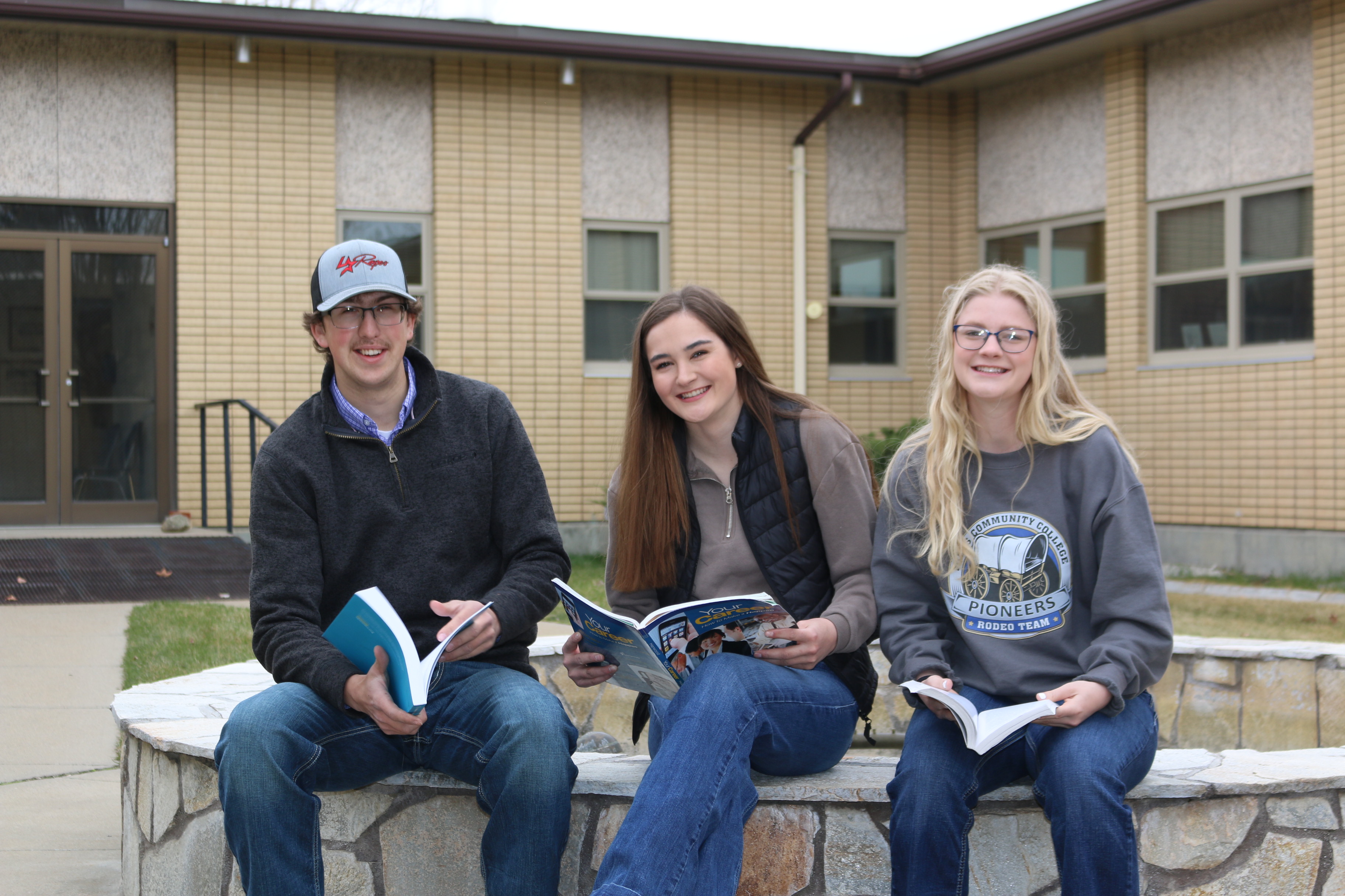 Image of four students studying