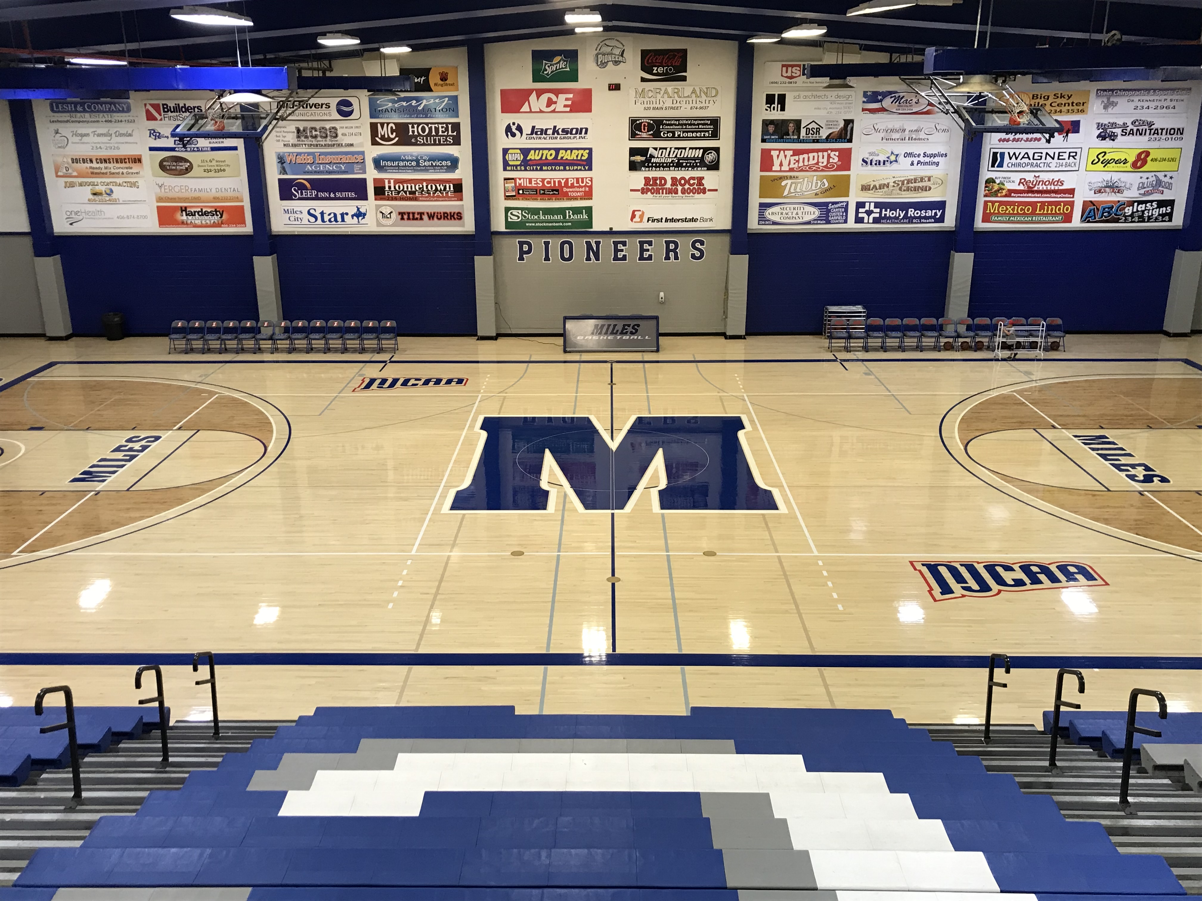 Graphic of gymnasium floor with logo