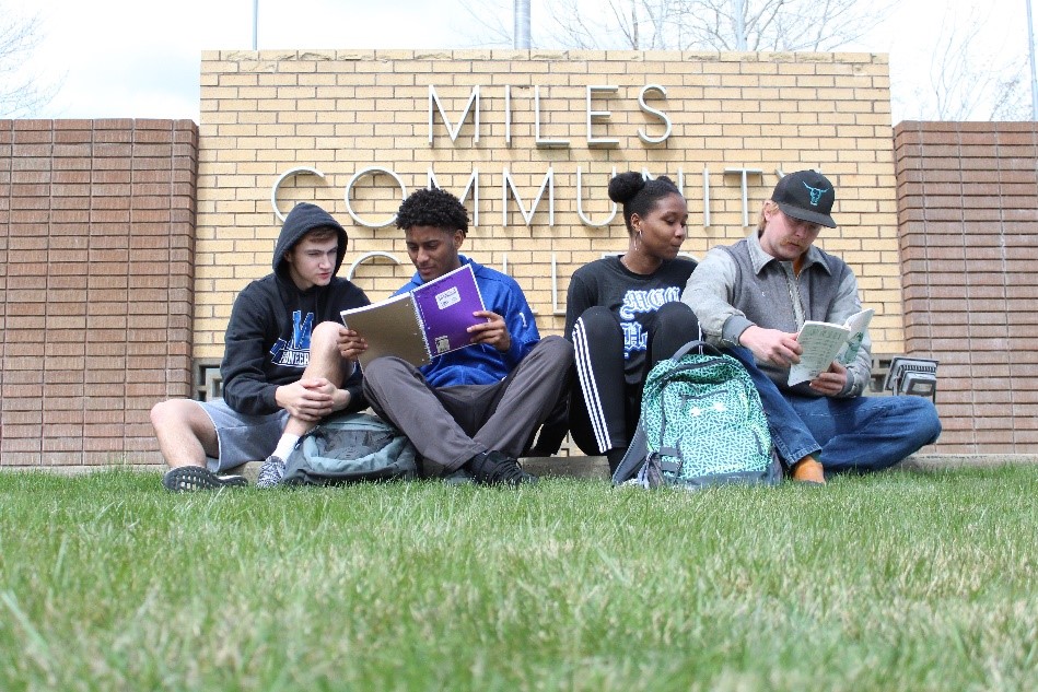 MCC Students studying on the campus lawn 