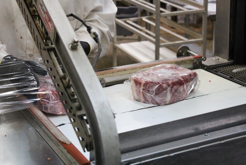 Processed meat being packaged at a local processing plant 
